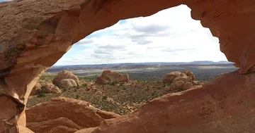 Flying the drone through a beautiful red rock arch Stock Footage 86153366