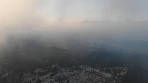 Flying drone through the clouds over the slopes of Mount Carmel, Israel. 库存影片 113318599
