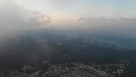 Flying drone through the clouds over the slopes of Mount Carmel, Israel. 库存影片 113319403