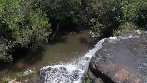 Flying with drone on top of a waterfall 動画素材 97838797