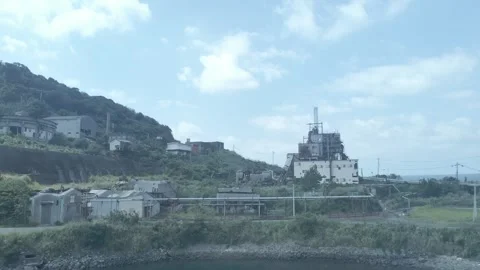 Flying a drone towards a coal mine Stock Footage 293951926