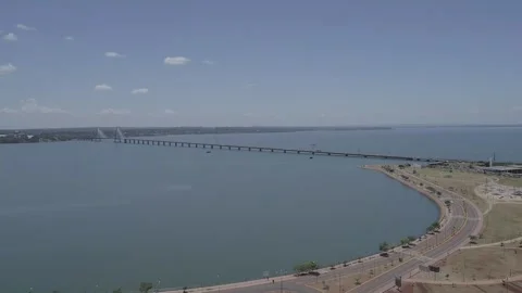 Flying with a drone towards the San Roque González bridge. 動画素材 264401260