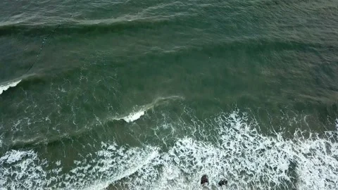 Flying by drone with a view of the beach and the sea with waves Stock Footage 158515308
