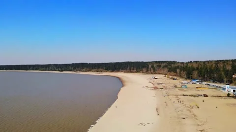 Flying a drone with a view of the sea and the beach against the blue sky. Stock Footage 133763267
