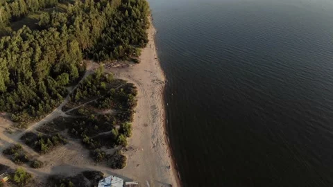 Flying a drone with a view of the sea and the beach against the blue sky. Stock Footage 133763883