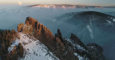 Flying a drone in winter among trees and rocks in frost Stock Footage 153659909