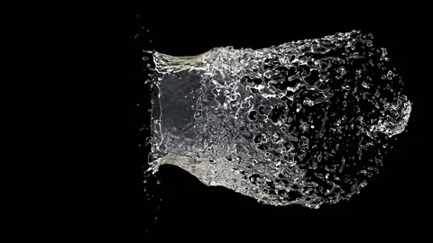 Flying drop breaks a water ball Stock Footage 126010804