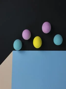 Flying easter eggs, eggs in the air above the cube, optical illusion, paper c Stock Photos
