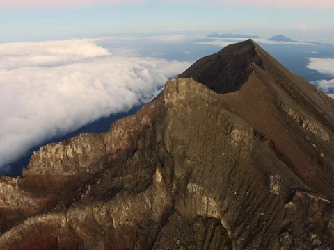 Flying to the edge of the Agung volcano crater in Bali, Indonesia (aerial video) Stock Footage 80583184