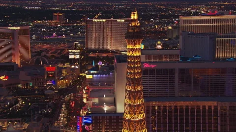 Flying by Eiffel Tower replica in Las Vegas at twilight. Shot in 2005. Stock Footage 59526384
