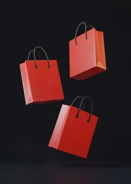 Flying empty red color shopping bags on the black background Illustrazione stock