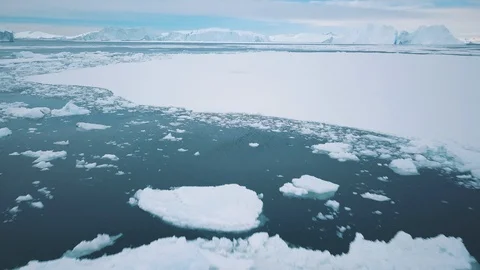 Flying fast and low over Greenland sea-ice, melting Arctic Stock Footage