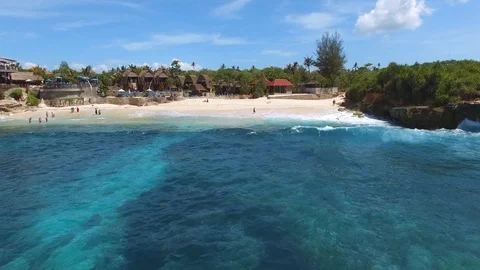 Flying fast over water and beautiful Dream Beach Stock Footage 111777144