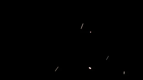Flying Fire Sparks in Slow Motion on Black Stockbeeldmateriaal 309475135