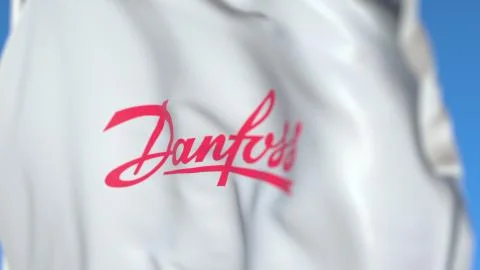 Flying flag with Danfoss Power Solutions logo, close-up. Editorial 3D rendering Illustrazione stock