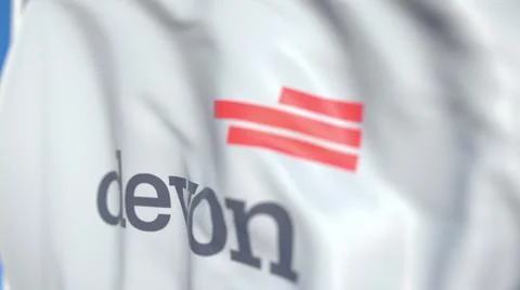 Flying flag with Devon Energy logo, close-up. Editorial 3D rendering Illustrazione stock