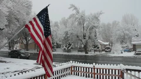 Flying the flag in snow storm 스톡 동영상 12532392