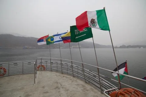 Flying flags at the front of ferry Stock Photos