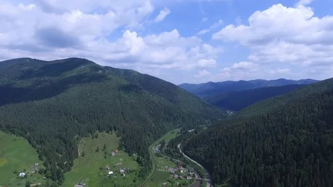 Flying from the forest over summer mountains in Ukraine Video stock 118388485