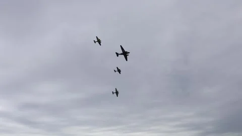 Flying formation cloudy sky vintage aircraft military parade warbirds teamwork p Stock Footage 311150190