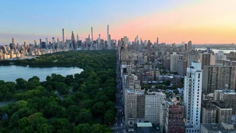 Flying Forward Along Central Park West Between Park and Upper West Side Stock Footage 345293630