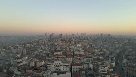 Flying forward to Galata Tower at Sunrise over old buildings. Stock Footage 144245944