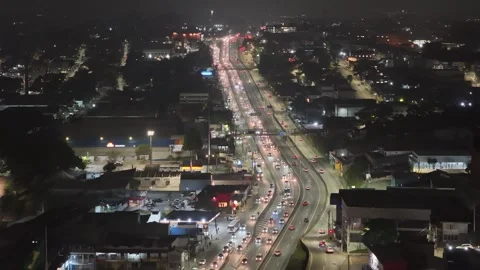 Flying forward at night along lit highway raposo tavares congestioned Stock Footage 342647000