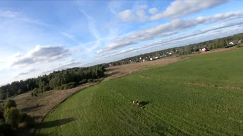 Flying on an fpv drone behind a horse, a girl on a horse Stock Footage 166831238