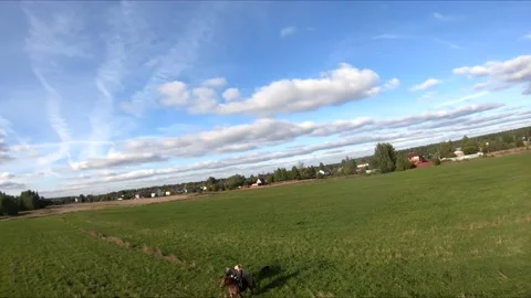 Flying on an fpv drone behind a horse, a girl on a horse Stock Footage 166831790