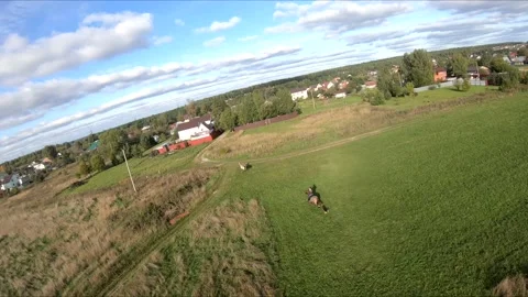 Flying on an fpv drone behind a horse, a girl on a horse Stock Footage 166833246