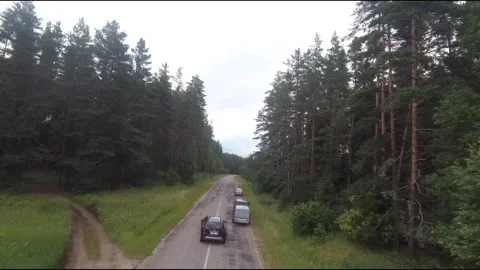 Flying fpv drone behind two cars Stock Footage 208616794