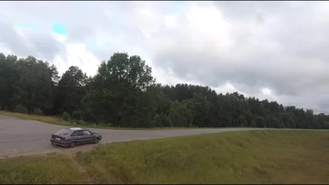 Flying fpv drone behind two cars Stock Footage 208616826