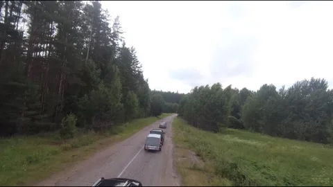 Flying fpv drone behind two cars Stock Footage 208616943
