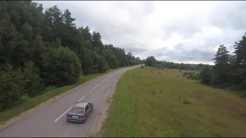 Flying fpv drone behind two cars Stock Footage 208617152