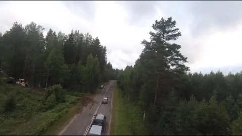 Flying fpv drone behind two cars Stock Footage 208617225