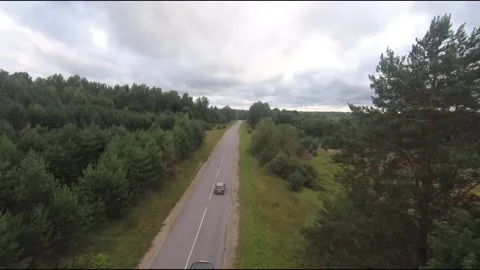 Flying fpv drone behind two cars Stock Footage 208617268