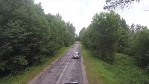 Flying fpv drone behind two cars Stock Footage 208617923