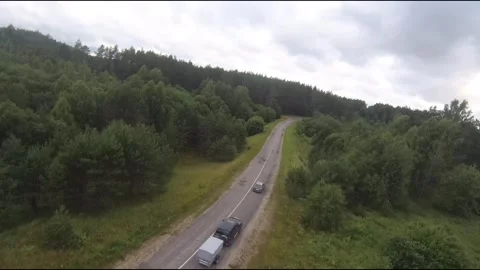 Flying fpv drone behind two cars Stock Footage 208617924