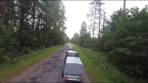 Flying fpv drone behind two cars Stock Footage 208618013