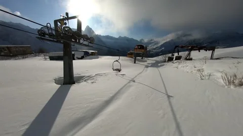 Flying an FPV drone in the mountains in winter white snow Stock Footage 234379884