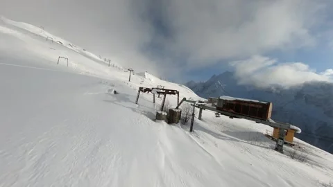 Flying an FPV drone in the mountains in winter white snow Stock Footage 234380148