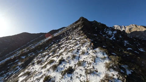 Flying on FPV Drone over mountains covered with snow on Convict lake in Eastern Stock Footage 270844591