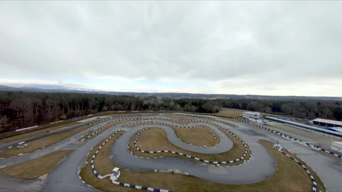 Flying FPV drone over racetrack Stock Footage 167942418