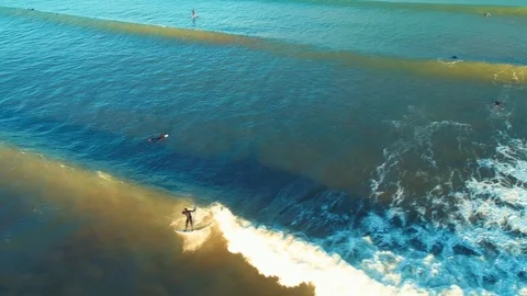 Flying in front of young surfer at sunset. Surfing on bigbeautiful wave Stock Footage 85626063