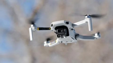 Flying Generic Drone With Camera Closeup Background Stock Photos