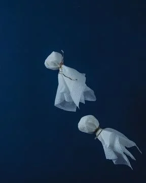Flying ghosts on dark background Stock Photos