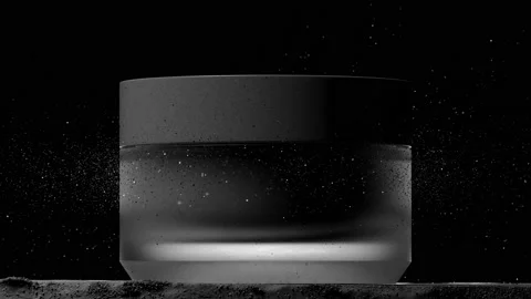 Flying glitter when opening a jar. Body care concept. Stock Footage 154124035