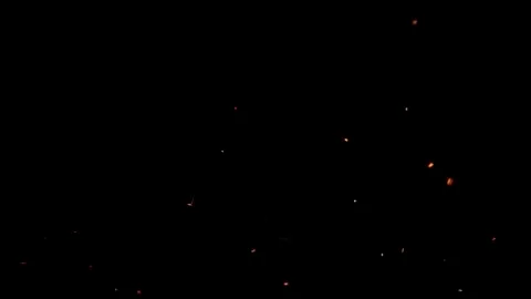 Flying glowing fire sparks with an black background Stock-Illustration