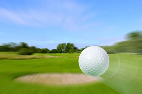 Flying golf ball Stock Photos