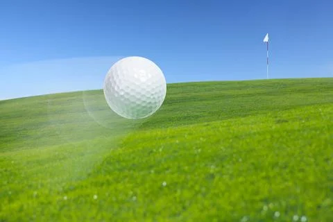 Flying golf ball Stock Photos